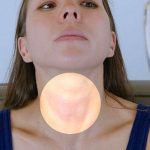 webmd_rf_photo_of_woman_checking_thyroid-copy