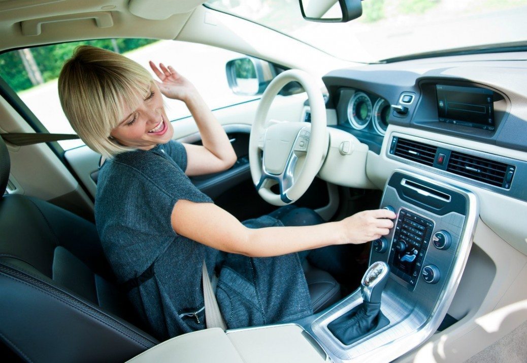 woman-listening-to-the-radio-in-her-car